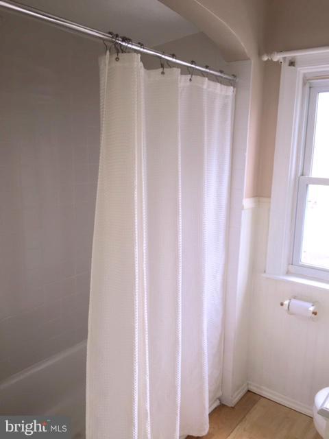 3014 Dunmurry Road Baltimore, MD 21222 - Photo 17 of 24 a bathroom with a shower and a window