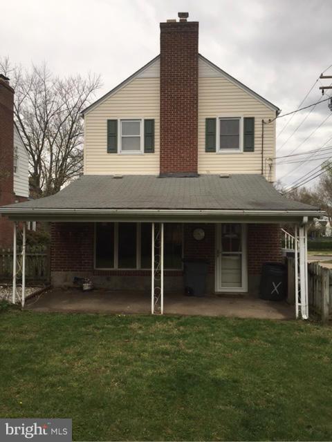 3014 Dunmurry Road Baltimore, MD 21222 - Photo 22 of 24 a front view of a house with a yard