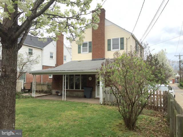 3014 Dunmurry Road Baltimore, MD 21222 - Photo 23 of 24 a front view of a house with a garden