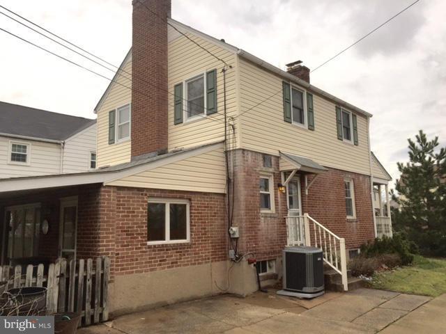 3014 Dunmurry Road Baltimore, MD 21222 - Photo 4 of 24 a front view of a house with a garage