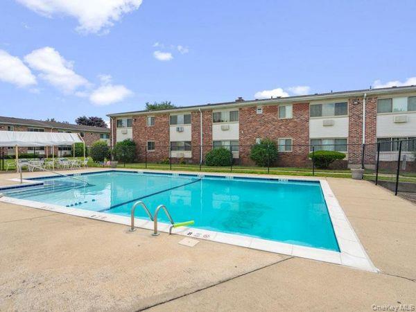 2423 Union Boulevard, Unit 8B Islip, NY 11751 - Photo 13 of 14 Community pool with a patio area