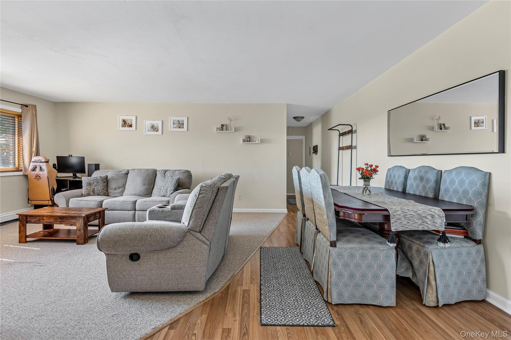 2423 Union Boulevard, Unit 8B Islip, NY 11751 - Photo 3 of 14 Living area with light wood-style floors and baseboards