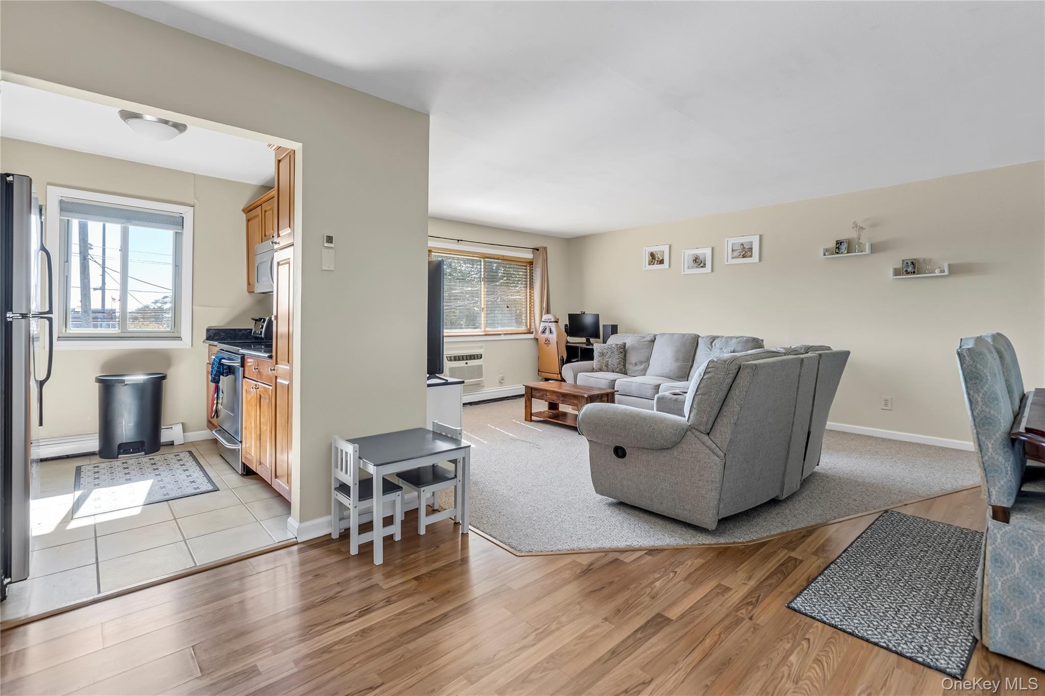 2423 Union Boulevard, Unit 8B Islip, NY 11751 - Photo 4 of 14 Living room with light wood-style floors and baseboard heating