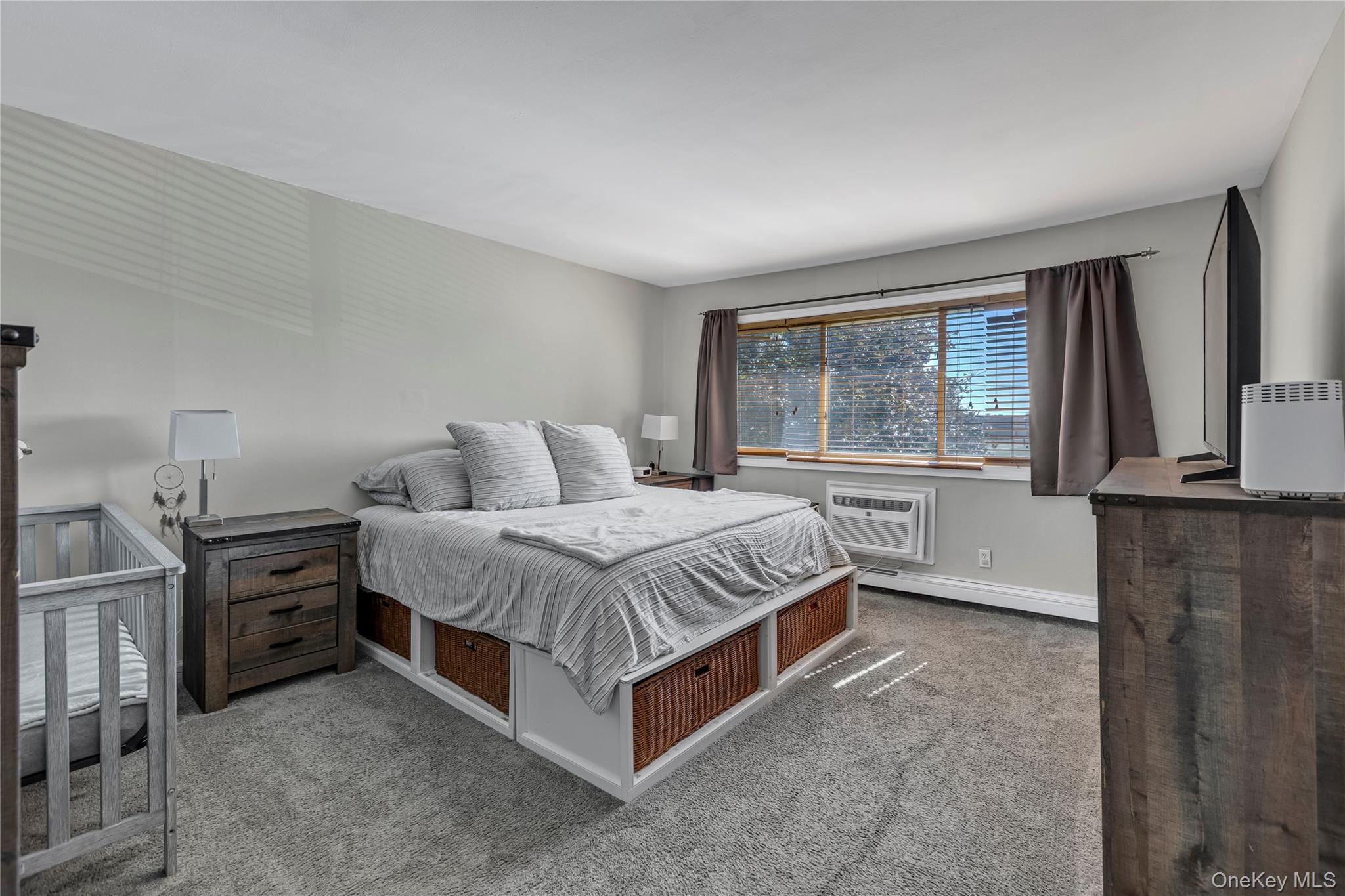 2423 Union Boulevard, Unit 8B Islip, NY 11751 - Photo 7 of 14 Bedroom with carpet flooring and a baseboard heating unit