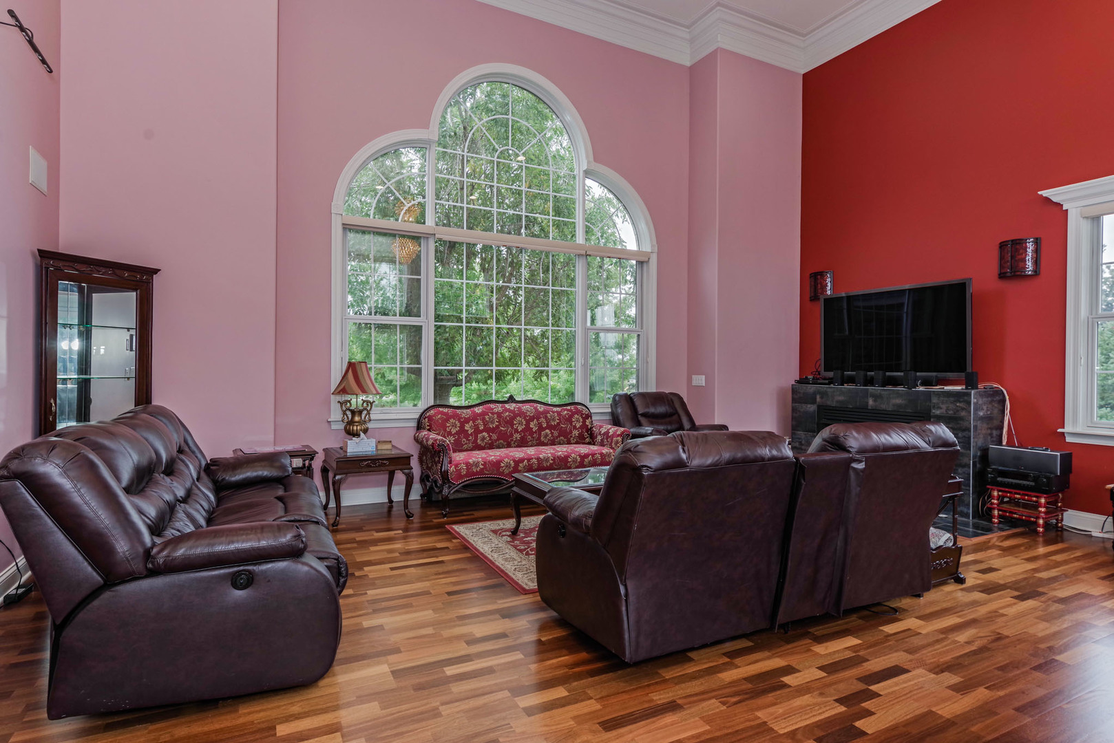 10470 Sturbridge Road Bloomington, IL 61705 - Photo 14 of 75 a living room with furniture and a flat screen tv