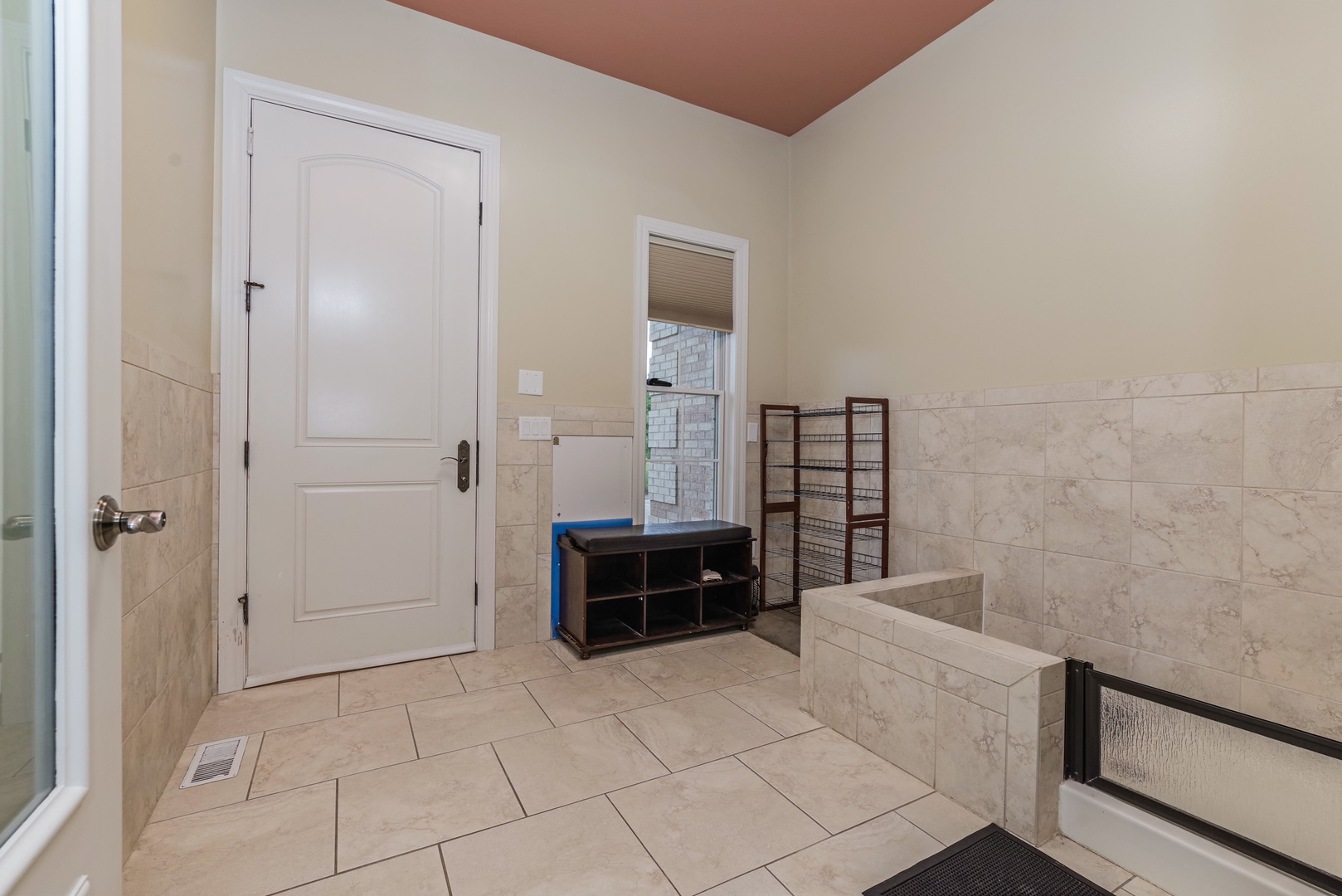 10470 Sturbridge Road Bloomington, IL 61705 - Photo 37 of 75 a spacious bathroom with a tub and checkered floor