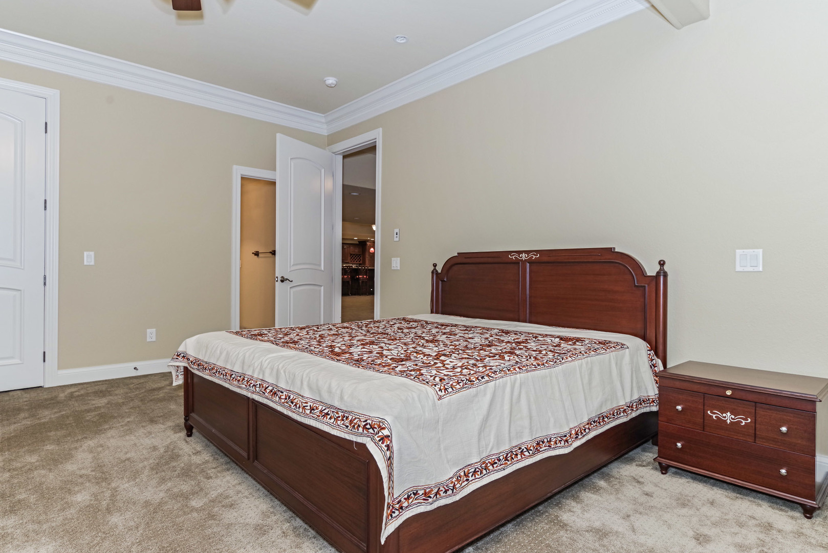 10470 Sturbridge Road Bloomington, IL 61705 - Photo 52 of 75 a bedroom with a bed and a cabinets