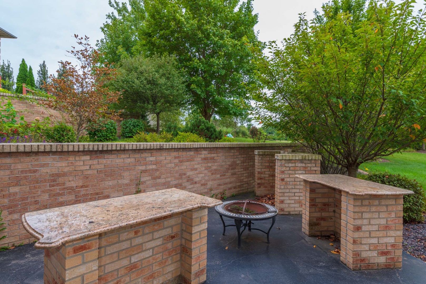 10470 Sturbridge Road Bloomington, IL 61705 - Photo 63 of 75 a backyard of a house with table and chairs