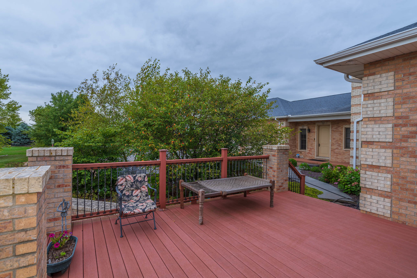 10470 Sturbridge Road Bloomington, IL 61705 - Photo 71 of 75 a balcony with wooden floor and outdoor seating