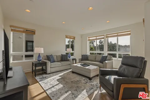 a living room with furniture and a table