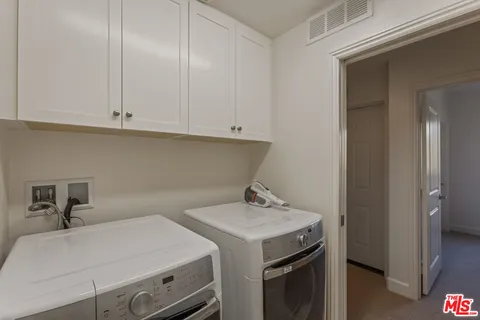 a view of a balcony with chairs