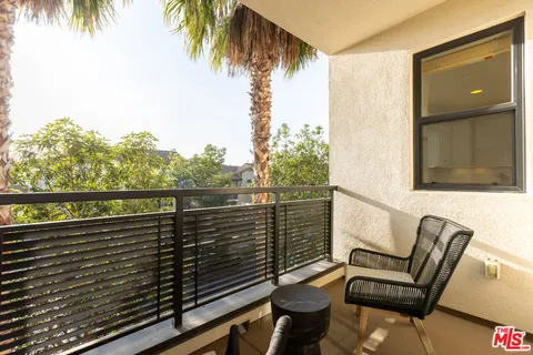 a view of balcony with furniture