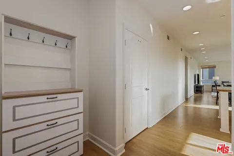a large kitchen with kitchen island a sink table and chairs