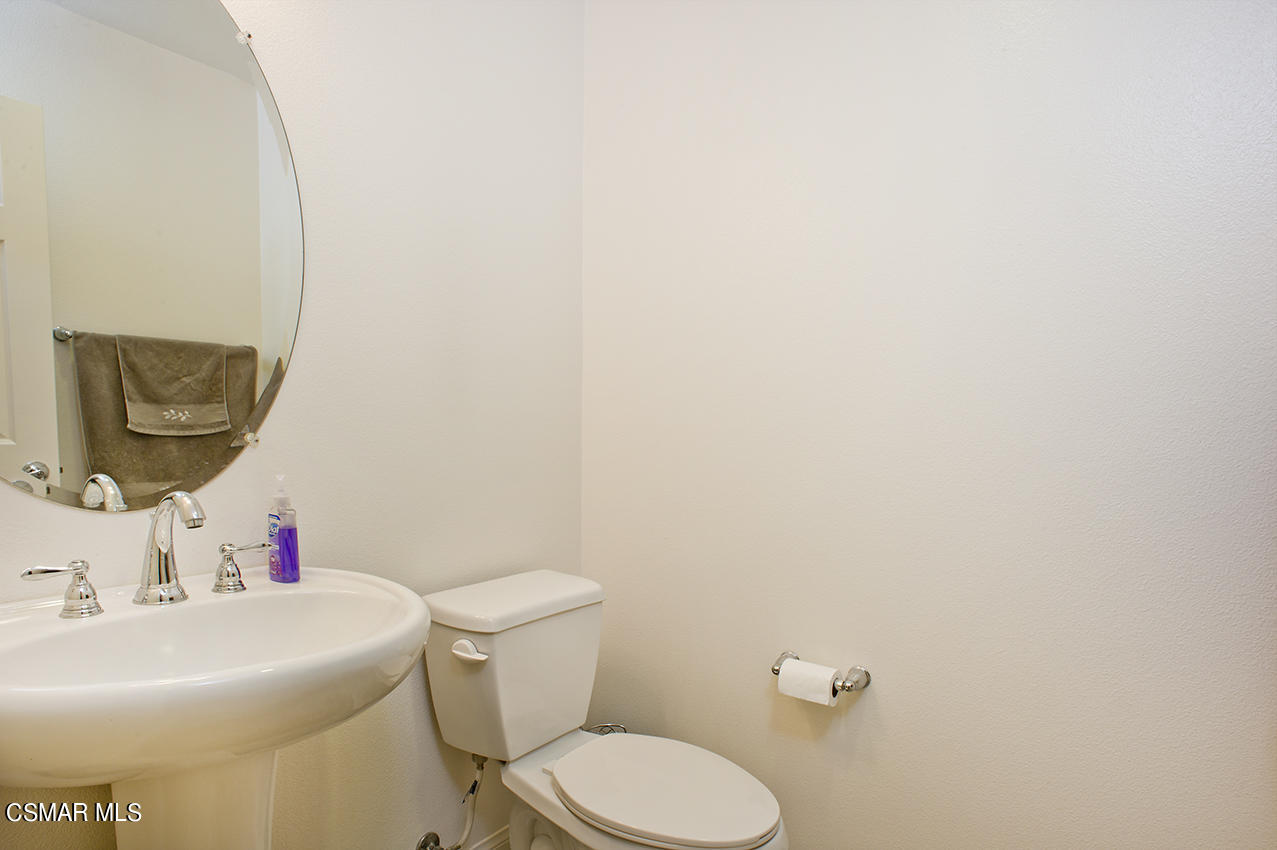 4813 Edenbridge Road Moorpark, CA 93021 - Photo 14 of 33 a bathroom with a sink and a mirror