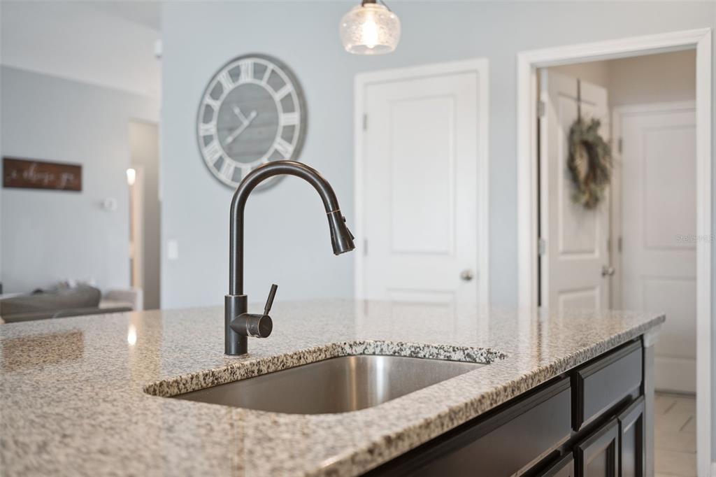 1725 Reflection Lane St. Cloud, FL 34771 - Photo 14 of 37 a close view of a sink and a faucet in a bathroom
