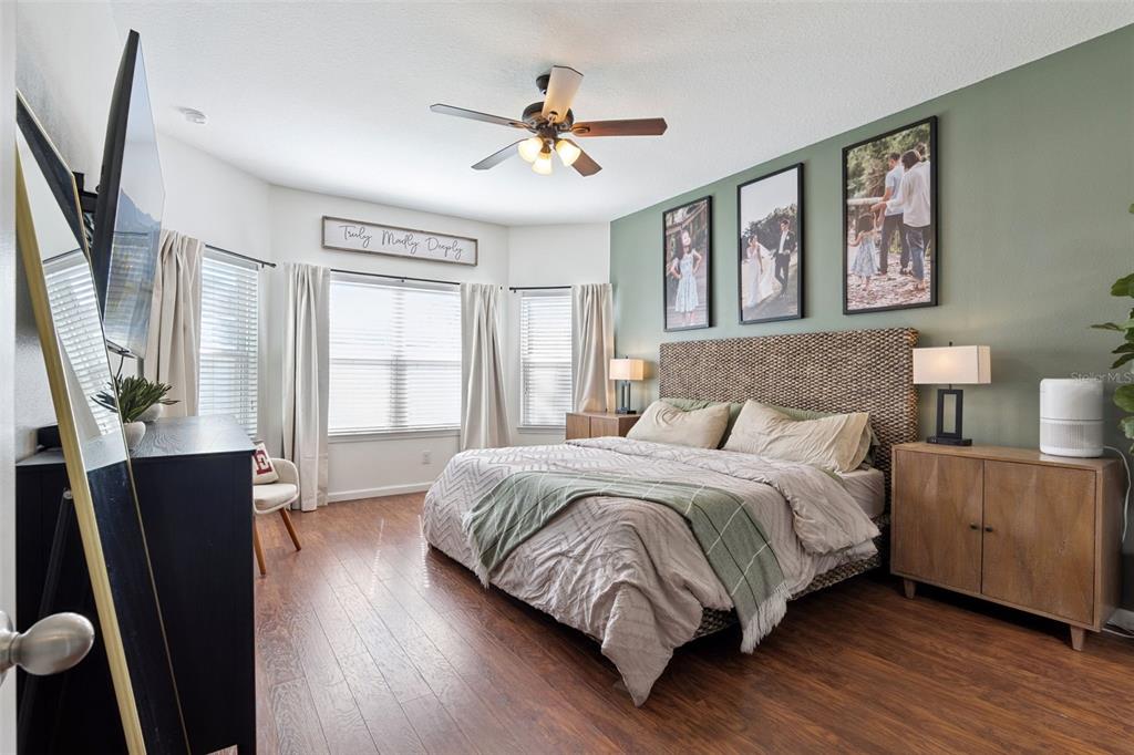 1725 Reflection Lane St. Cloud, FL 34771 - Photo 18 of 37 a bedroom with a large bed and a window