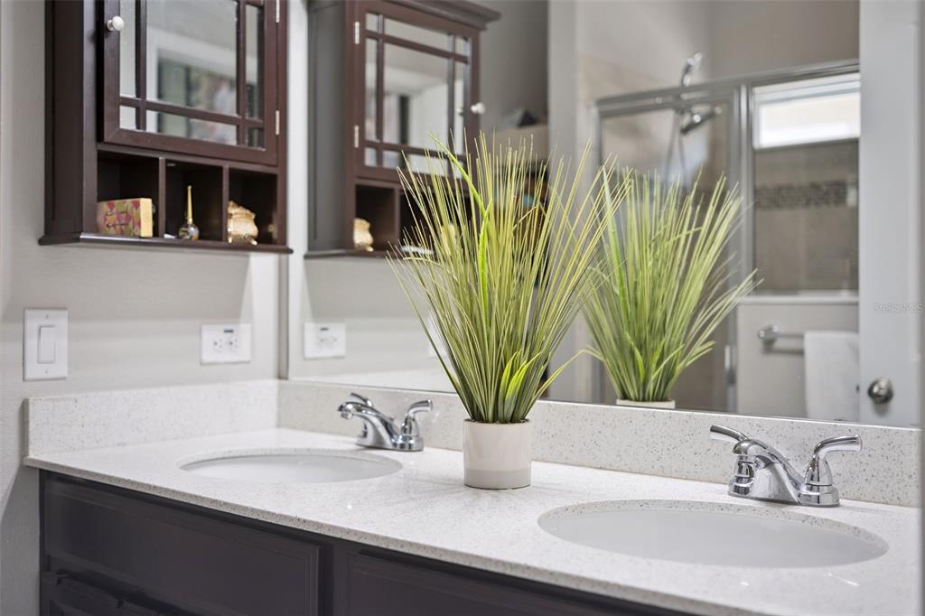 1725 Reflection Lane St. Cloud, FL 34771 - Photo 23 of 37 a bathroom with a sink a mirror and a vanity