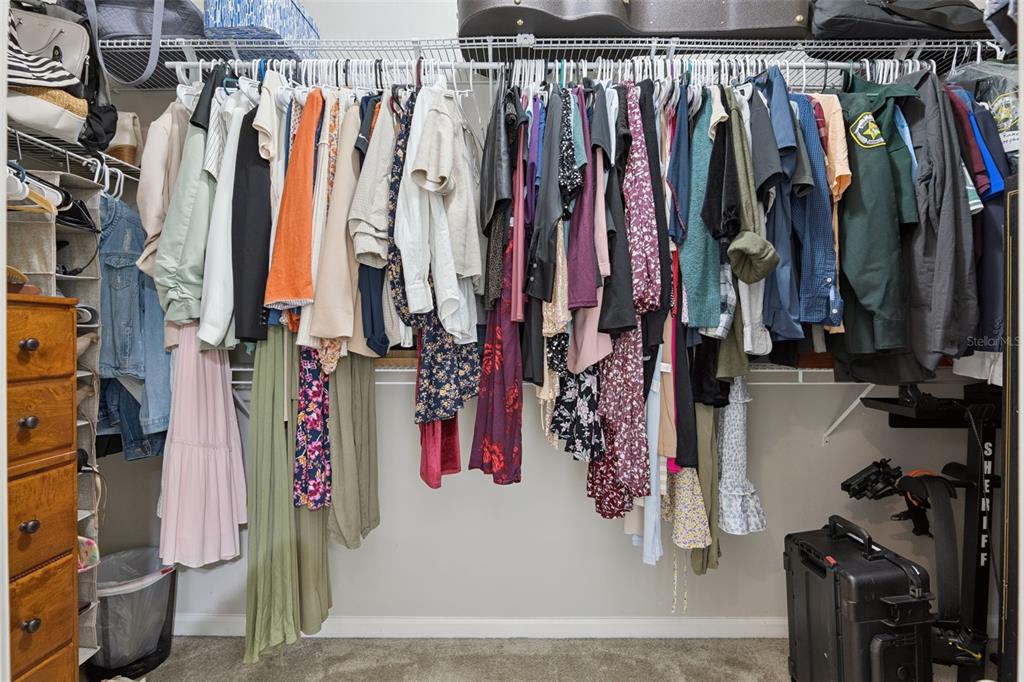 1725 Reflection Lane St. Cloud, FL 34771 - Photo 24 of 37 a view of walk in closet with clothes