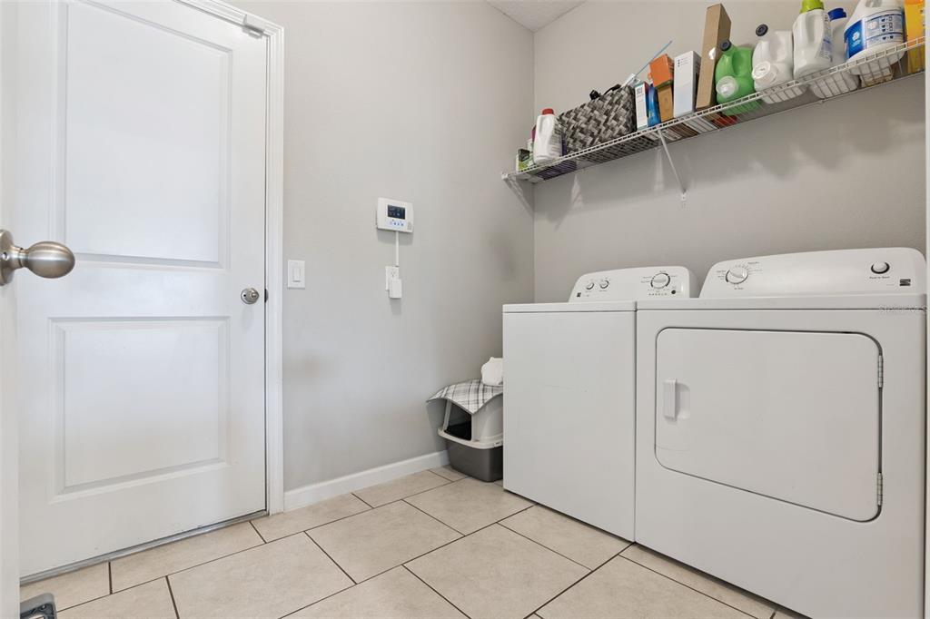 1725 Reflection Lane St. Cloud, FL 34771 - Photo 30 of 37 a utility room with dryer and washer