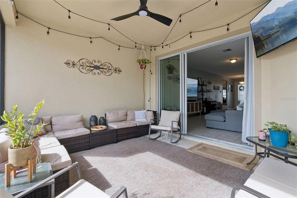 1725 Reflection Lane St. Cloud, FL 34771 - Photo 31 of 37 a living room with furniture and a chandelier