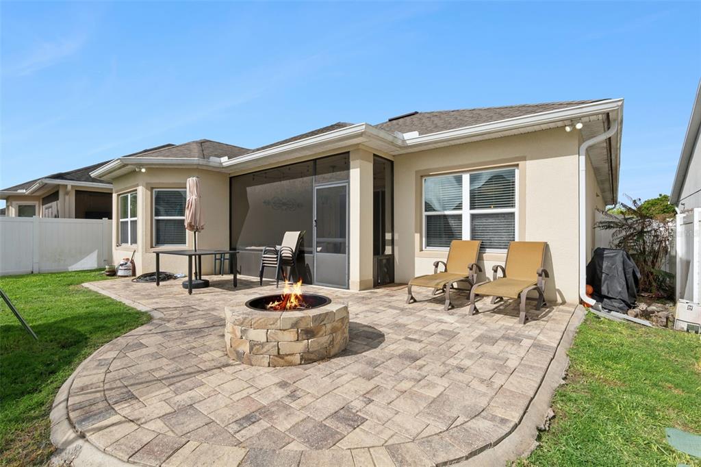 1725 Reflection Lane St. Cloud, FL 34771 - Photo 33 of 37 a front view of a house with patio
