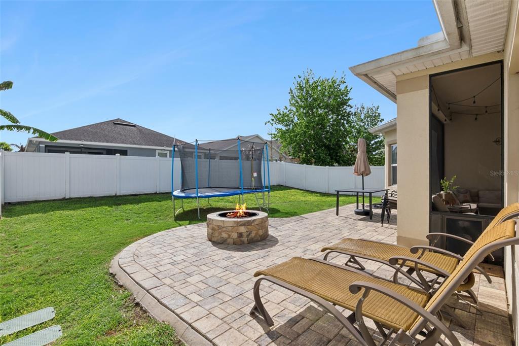 1725 Reflection Lane St. Cloud, FL 34771 - Photo 34 of 37 a view of backyard of house with seating space