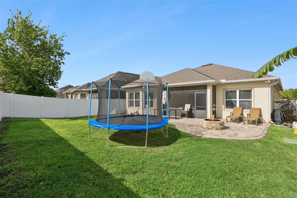 1725 Reflection Lane St. Cloud, FL 34771 - Photo 35 of 37 a view of a house with a yard porch and sitting area