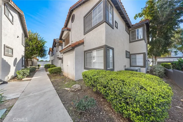 a view of a front of a house with a yard