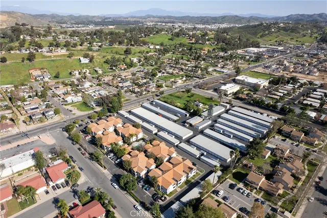 an aerial view of a city with mountains