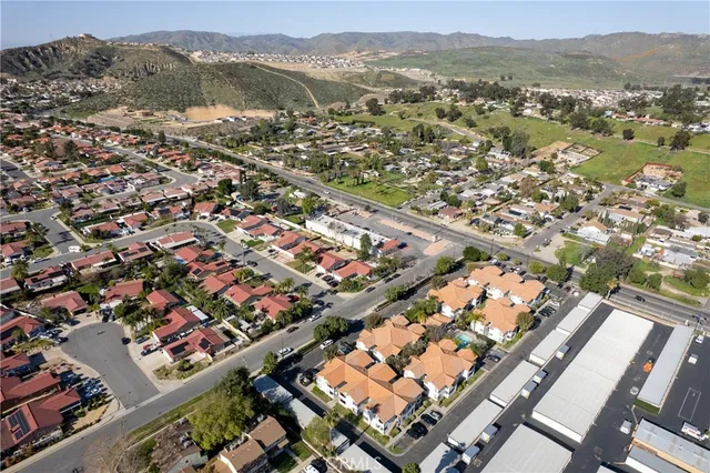 an aerial view of city and lake