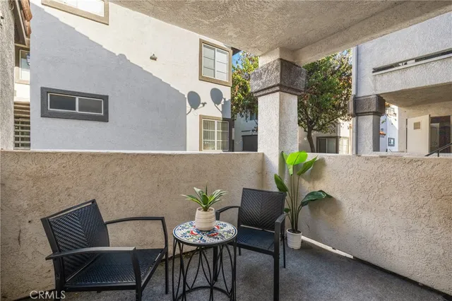 a outdoor space with a couch and chairs