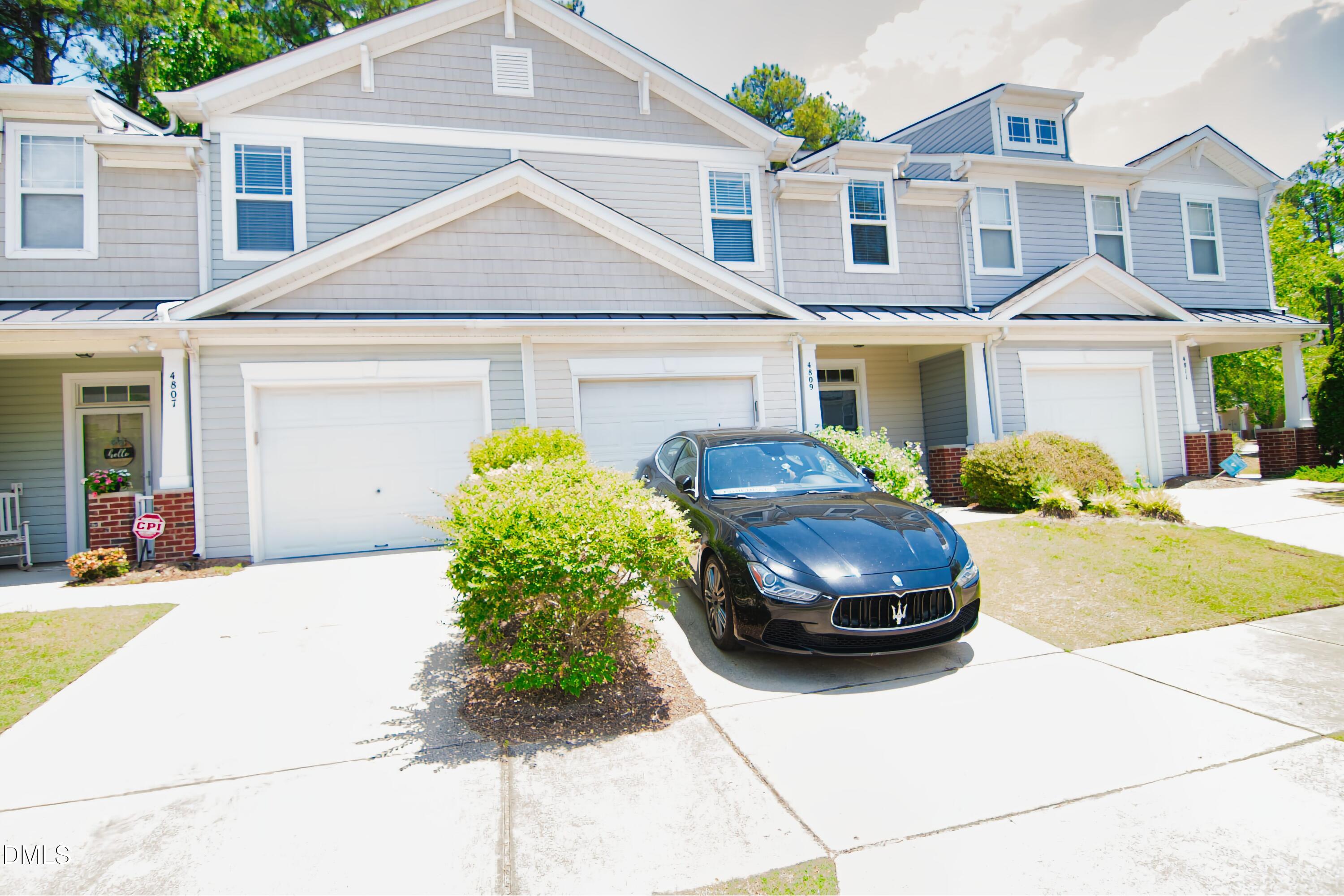 4809 Landover Pine Place Raleigh, NC 27616 - Photo 1 of 14 a front view of a house with a yard and garage