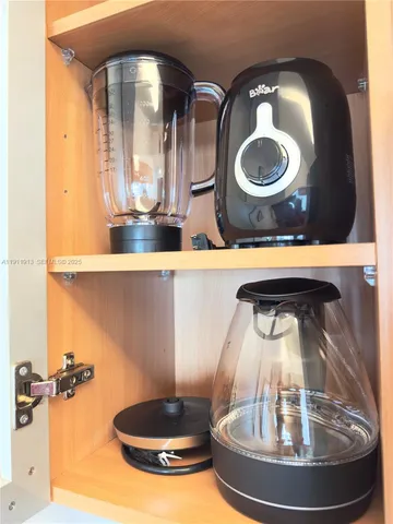 a utility room with a refrigerator