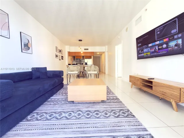 a living room with furniture and a rug