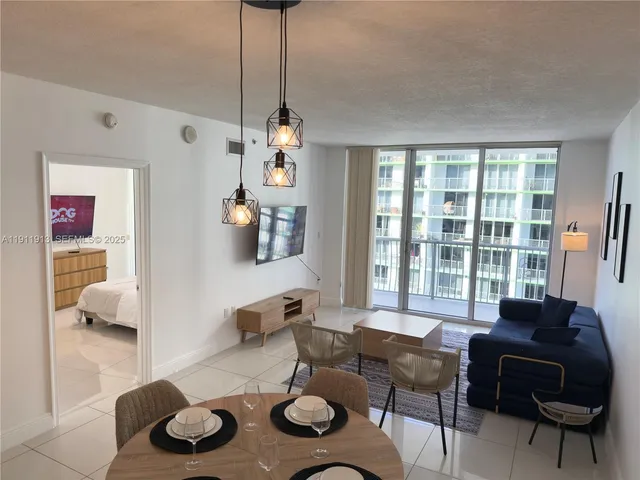 a living room with furniture and a table