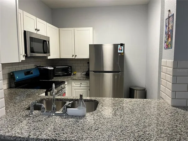 $1,467 | 2572 Robert Trent Jones Drive, Unit 1220, Orlando, FL 32835