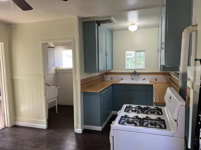 a kitchen with sink and stove