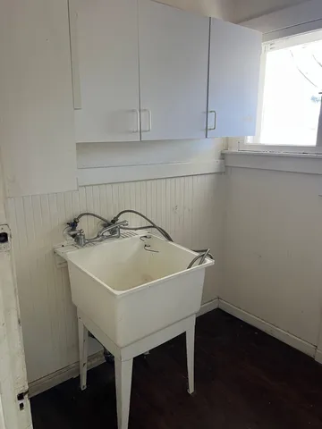 a view of a sink and cabinets in a kitchen