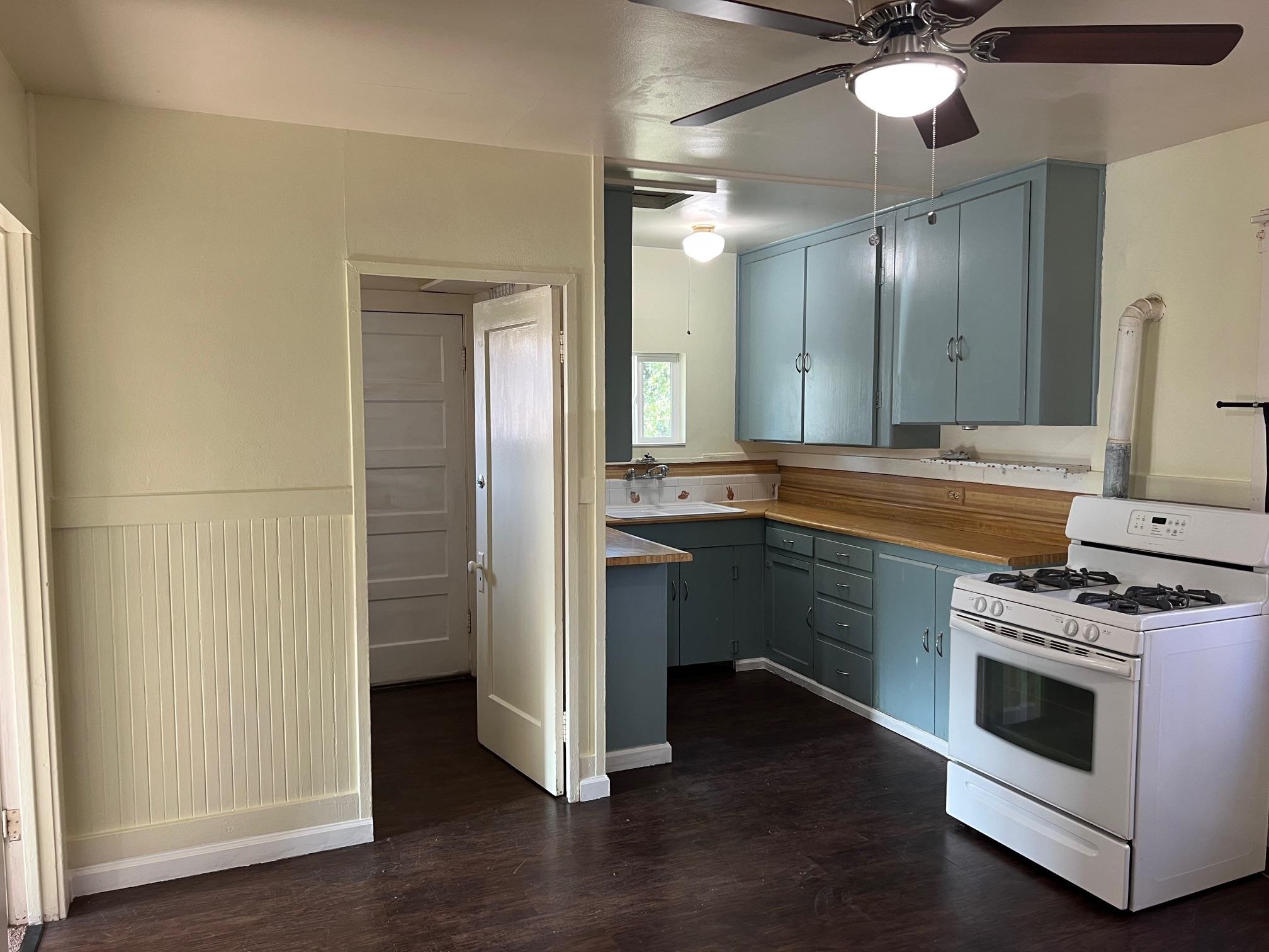 22771 Inyo Street Hayward, CA 94541 - Photo 4 of 29 a kitchen with a sink and a stove top oven
