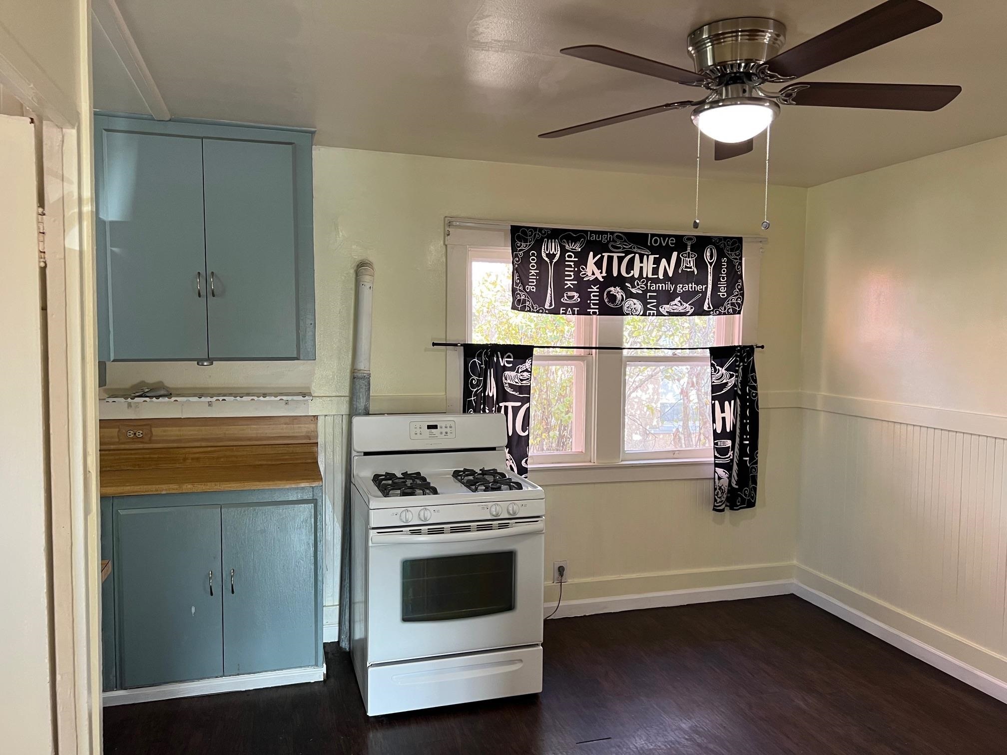 22771 Inyo Street Hayward, CA 94541 - Photo 5 of 29 a kitchen with stainless steel appliances a stove a microwave and a potted plant