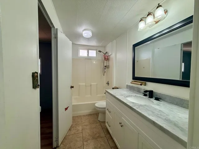 a view of a big room with windows