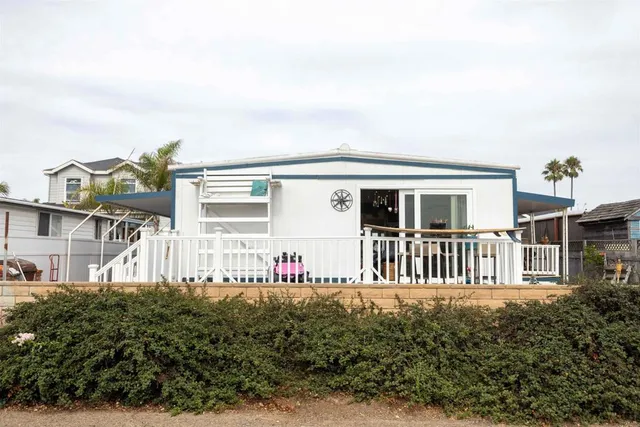 a view of a chairs and table in the balcony