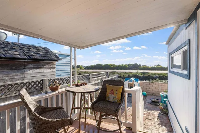 a view of balcony with sunset view