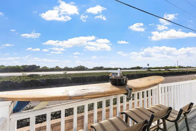 a view of balcony with furniture