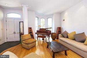 1312 R Street Northwest, Unit B Washington, DC 20009 - Photo 2 of 17 a living room with furniture and a potted plant