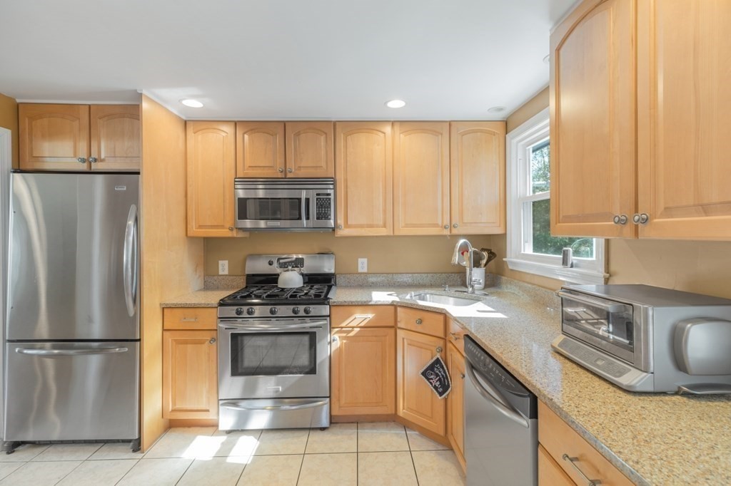 4 Birchmeadow Circle Framingham, MA 01701 - Photo 10 of 42 a kitchen with a sink a stove and refrigerator