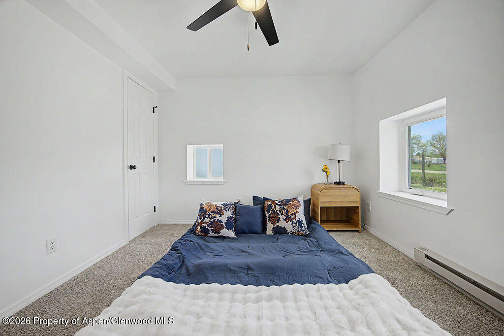 54 South Ranney Street Craig, CO 81625 - Photo 7 of 32 a bed room with a bed and a window