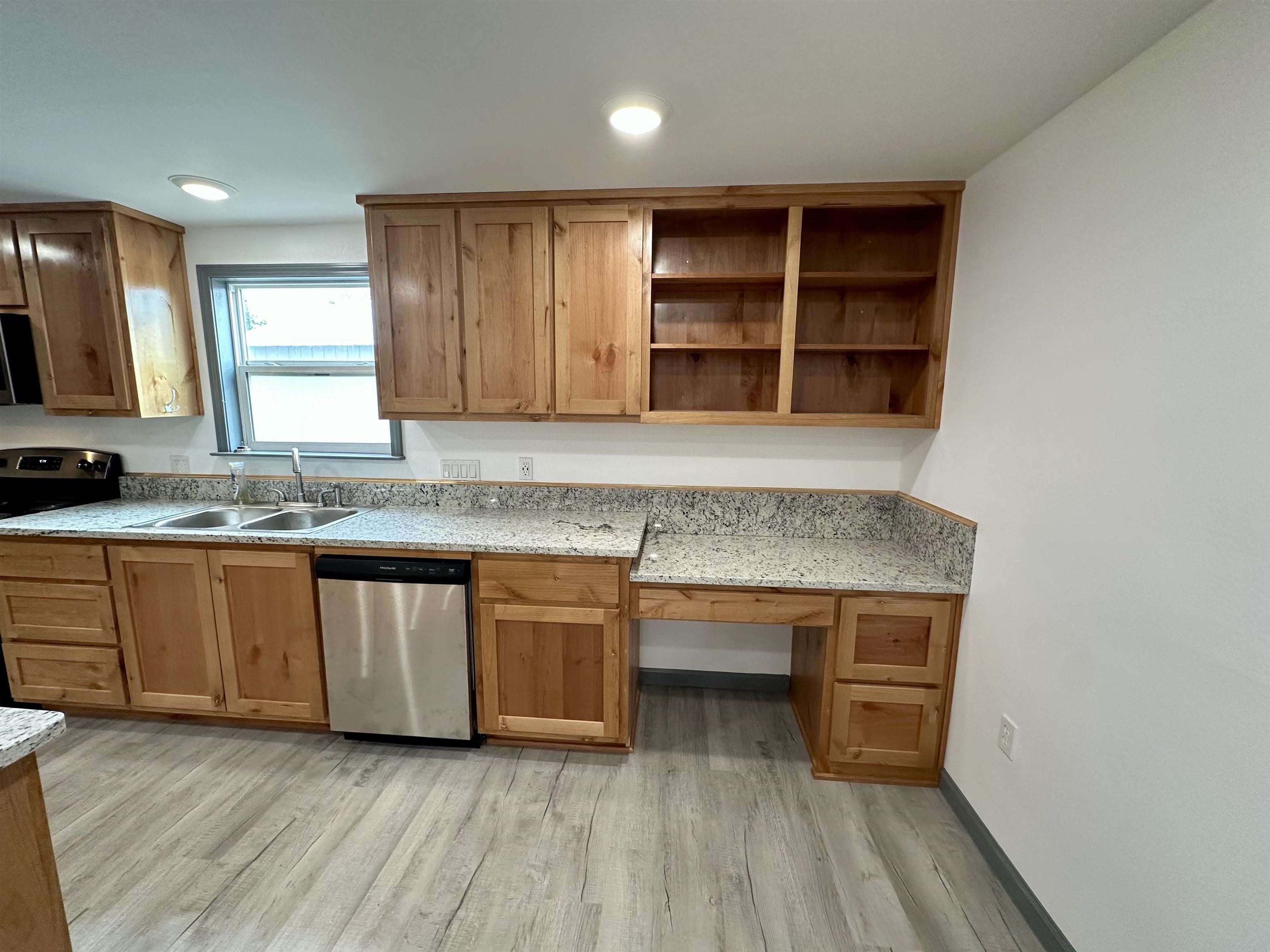 3410 Cactus Trail Kingsland, TX 78639 - Photo 11 of 26 an empty room with wooden floor and cabinet