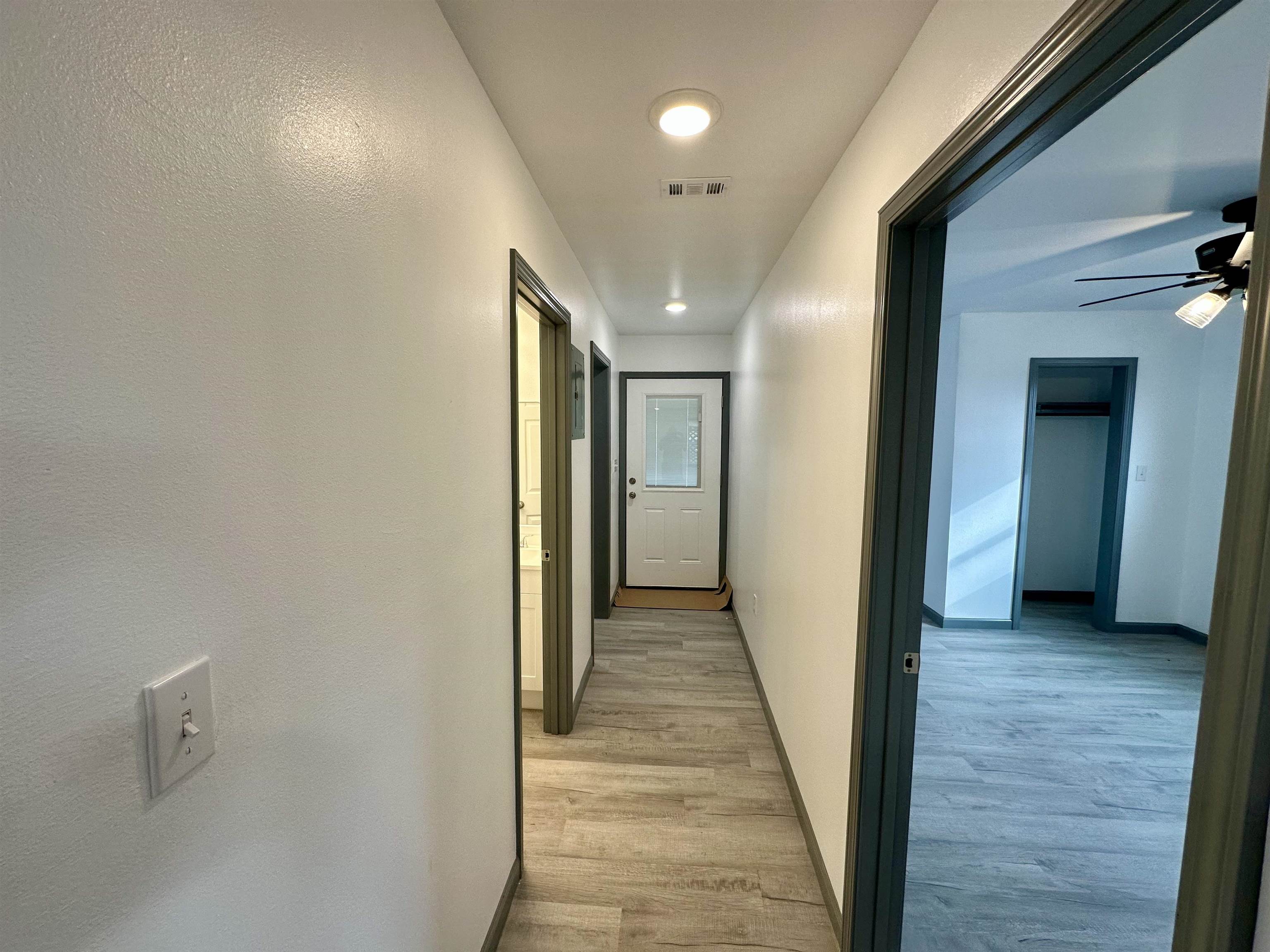 3410 Cactus Trail Kingsland, TX 78639 - Photo 12 of 26 a view of a hallway with wooden floor