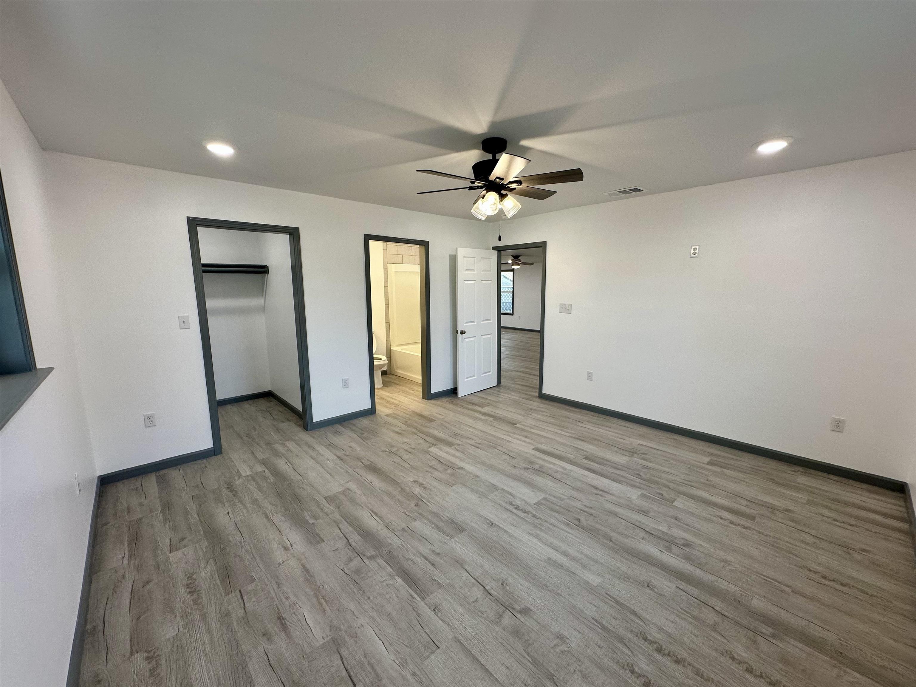 3410 Cactus Trail Kingsland, TX 78639 - Photo 17 of 26 wooden floor in an empty room with a window